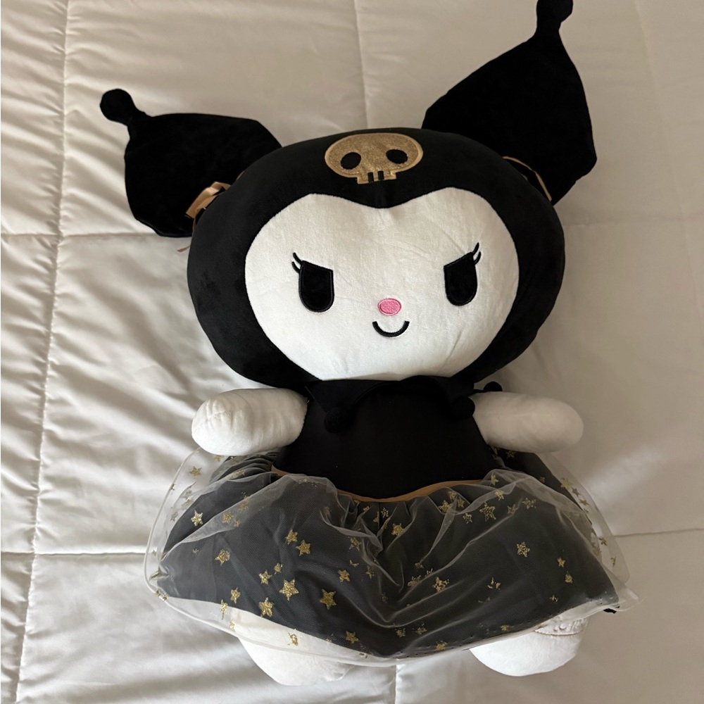 Black and White Plush Toy with Gold Accents